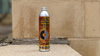Green Oil Agent Apple Degreaser. A silver can with orange packaging against a yellow brick background.