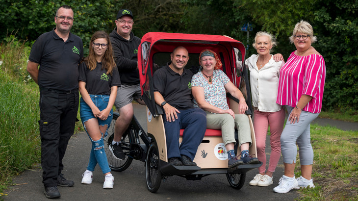 Staff from Own Yer Bike, Sustrans, Renfrewshire Council pictured alongside a trishaw in Renfrewshire