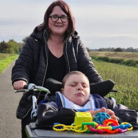 Adam with his carer Gemma on the Water Rail Way, Lincolnshire
