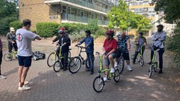 Sustrans staff working with Riverside Hostels customers outdoors.