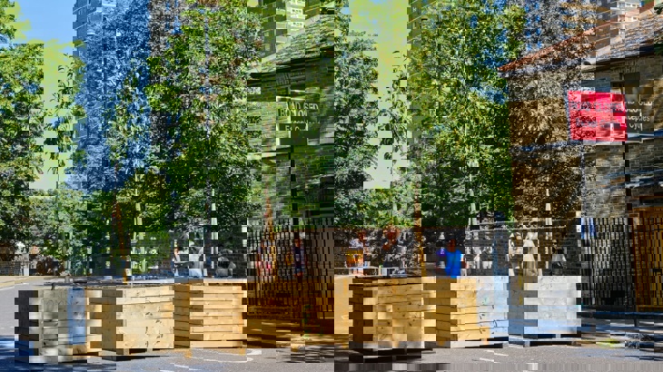 Planters used on a residential street in London to make it safer to walk and cycle