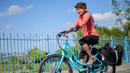A woman cycling an e-bike in Barry